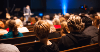 What to do When a New Church Comes to Town Church pews filled with congregants